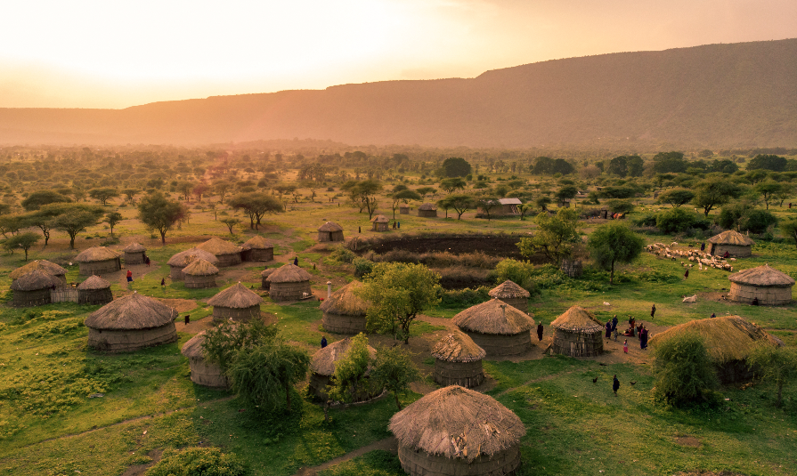 Aerial Drone Shot. Traditional Masai village at Sunset time near Arusha, Tanzania
